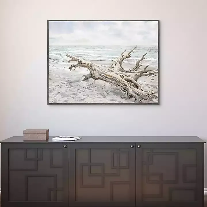 Driftwood On The Beach Framed Canvas Art Print