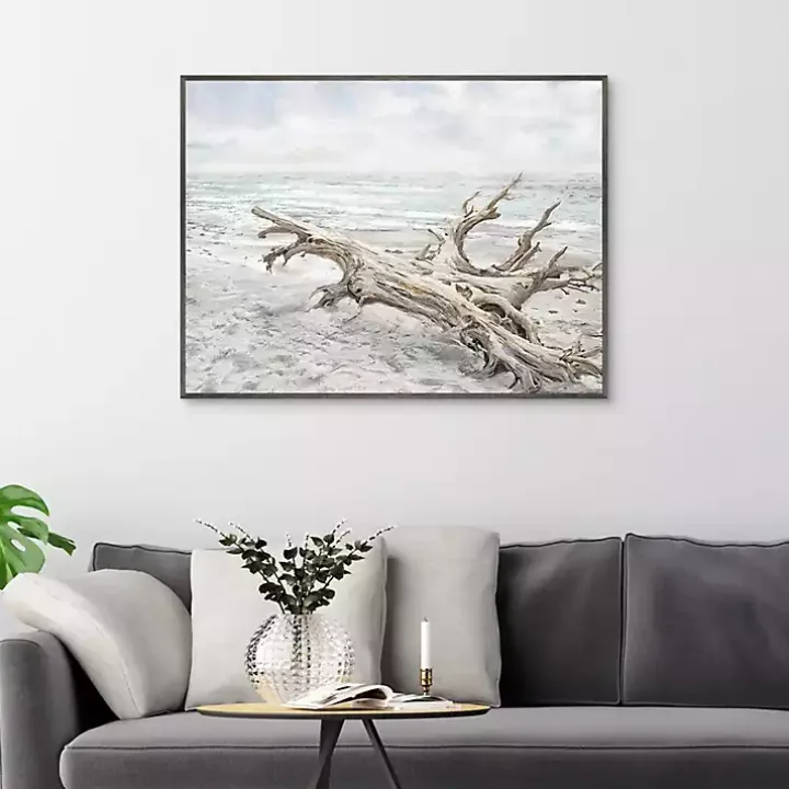 Driftwood On The Beach Framed Canvas Art Print